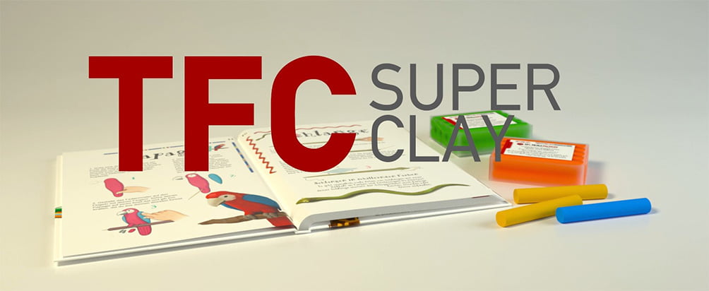 TFC Superclay Banner Banner mit TFC Superclay in Orange, Grün, Gelb und Blau sowie einem Bastelbuch im Hintergrund